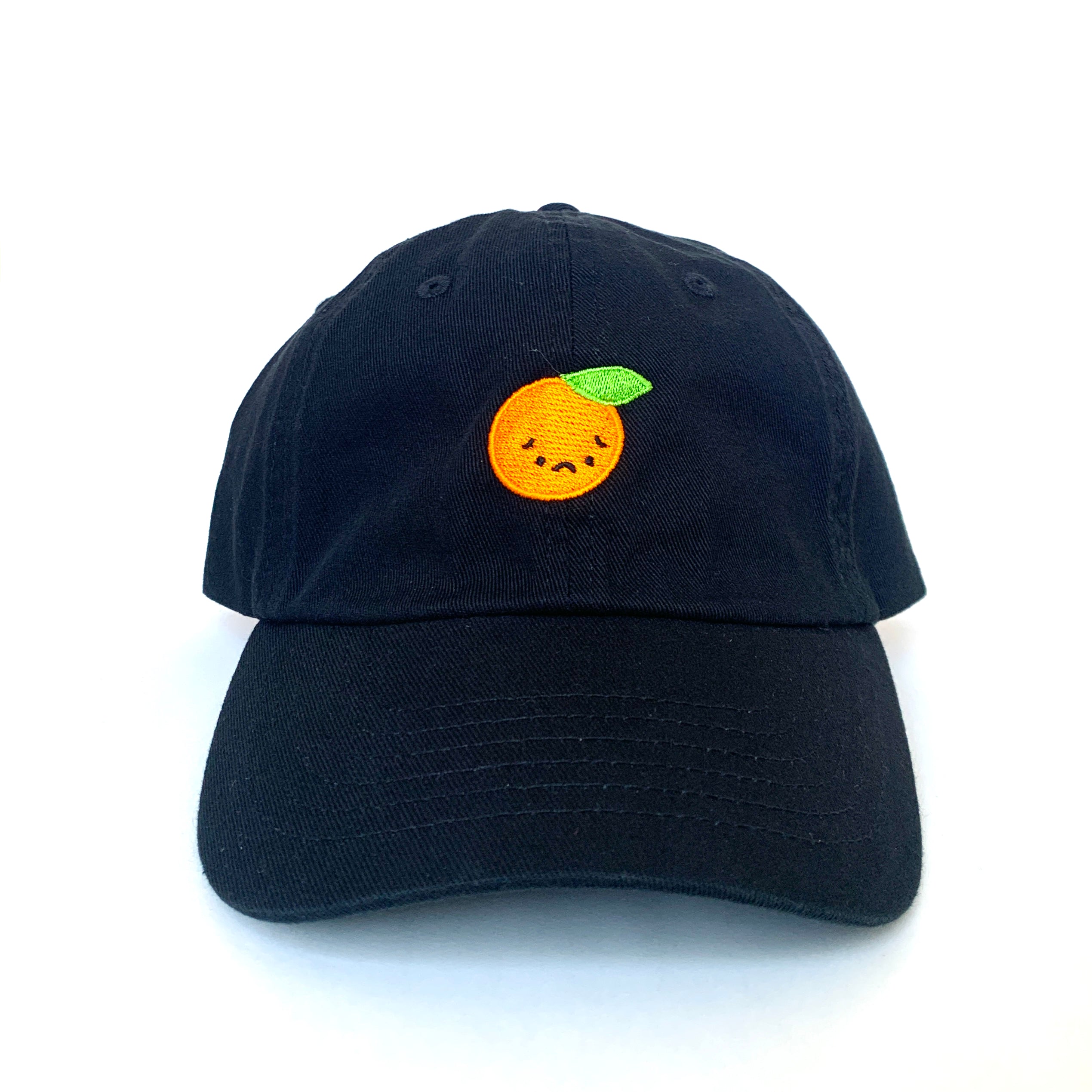 Black baseball cap with sad orange embroidered on front.