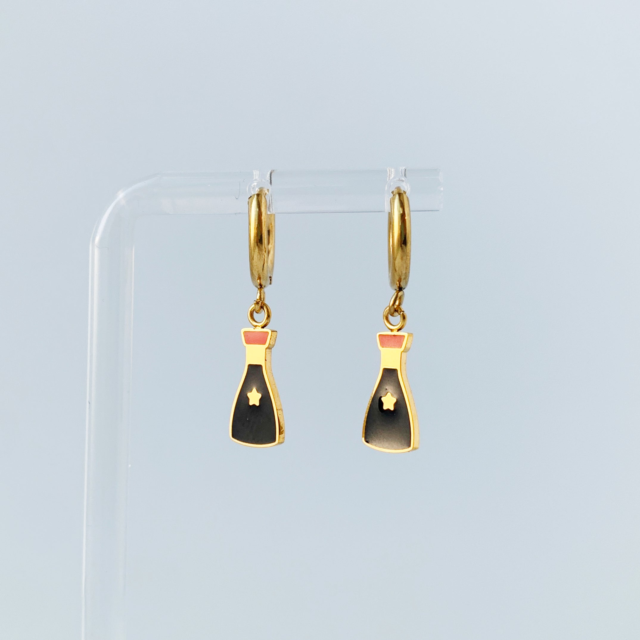 Small gold hoop earrings with charms of a soy sauce bottles