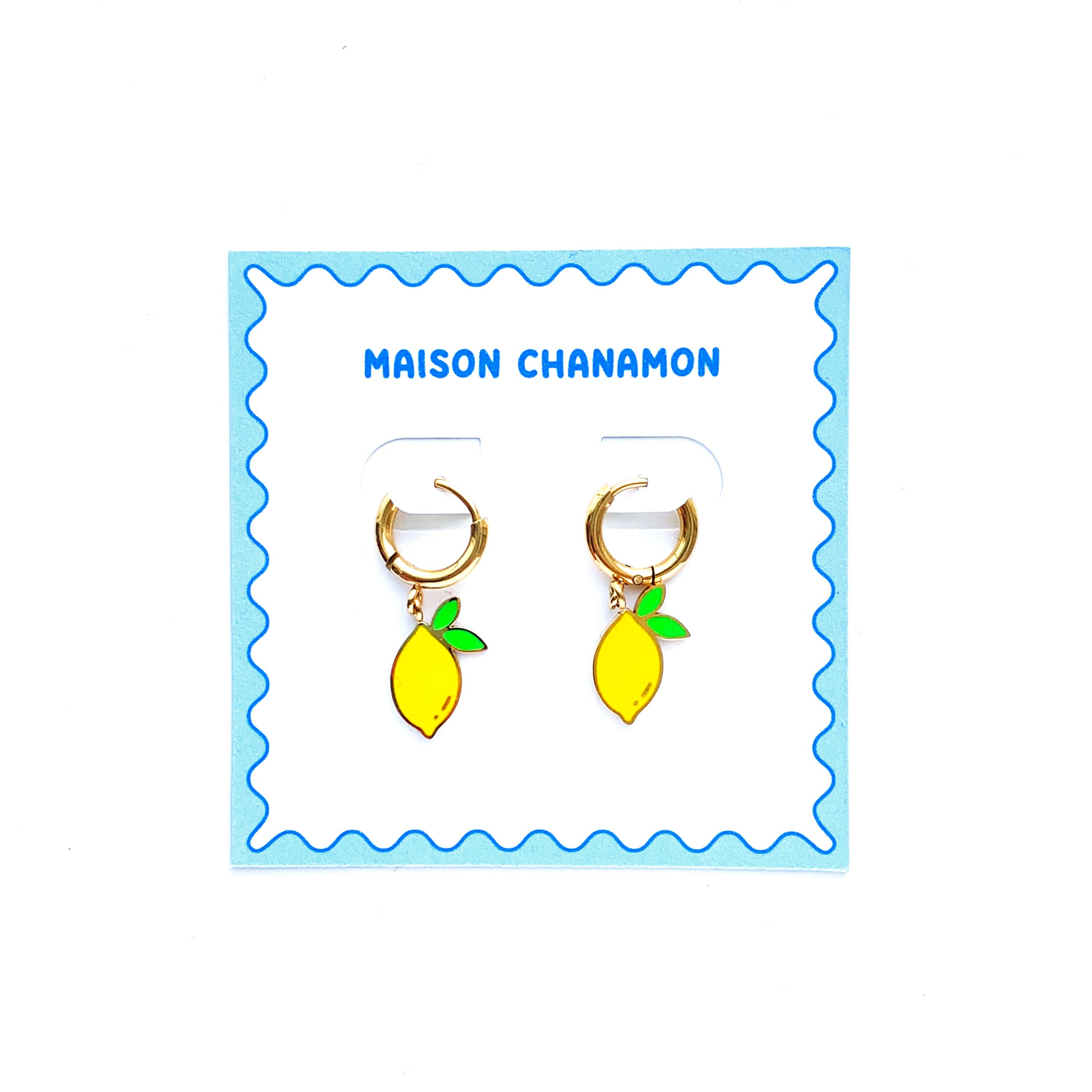 Lemons with 2 leaves enamel charms on gold huggie hoop earrings on a backing card