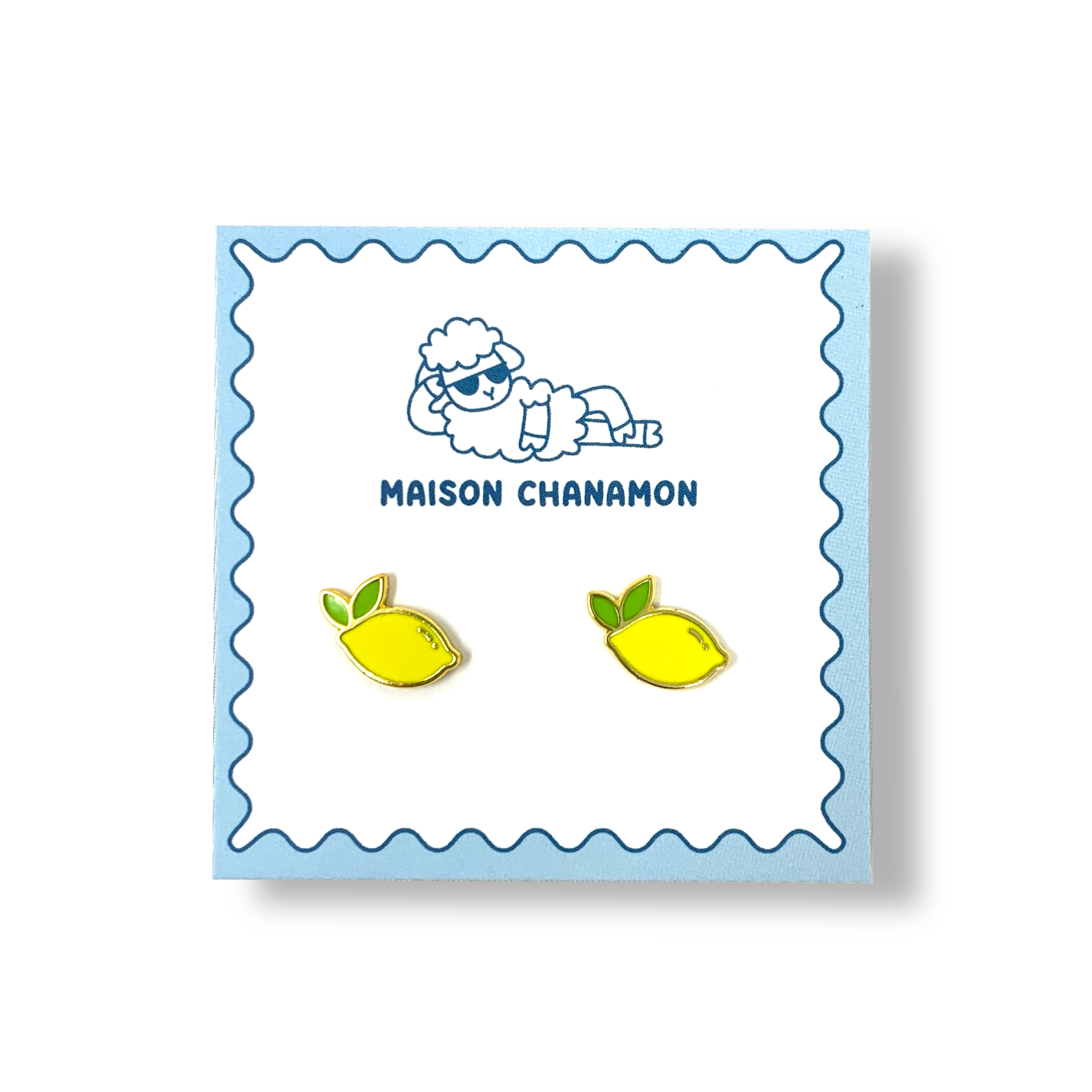 A pair of lemon enamel studs on a backing card