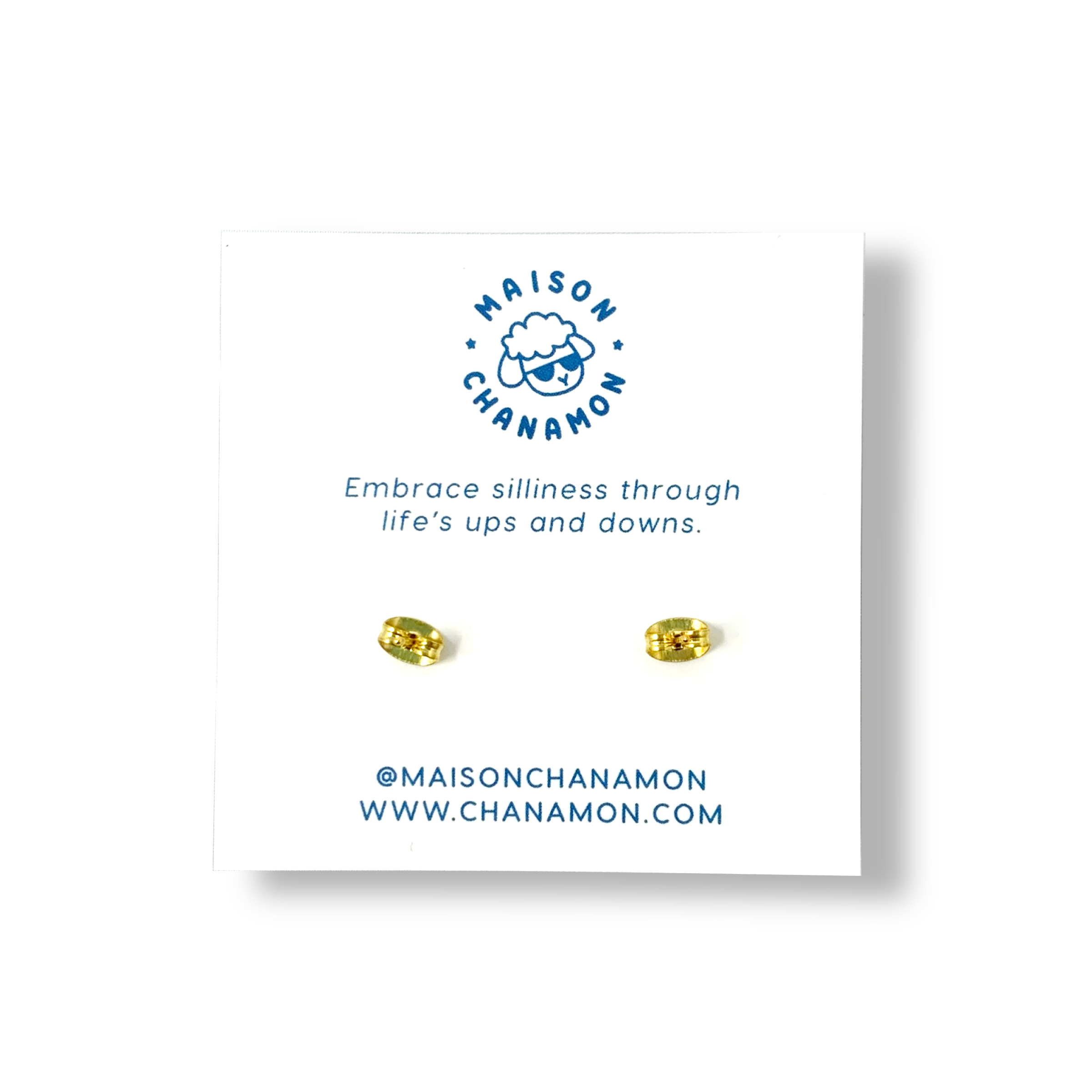 The back of a display card with a pair of gold stud earrings