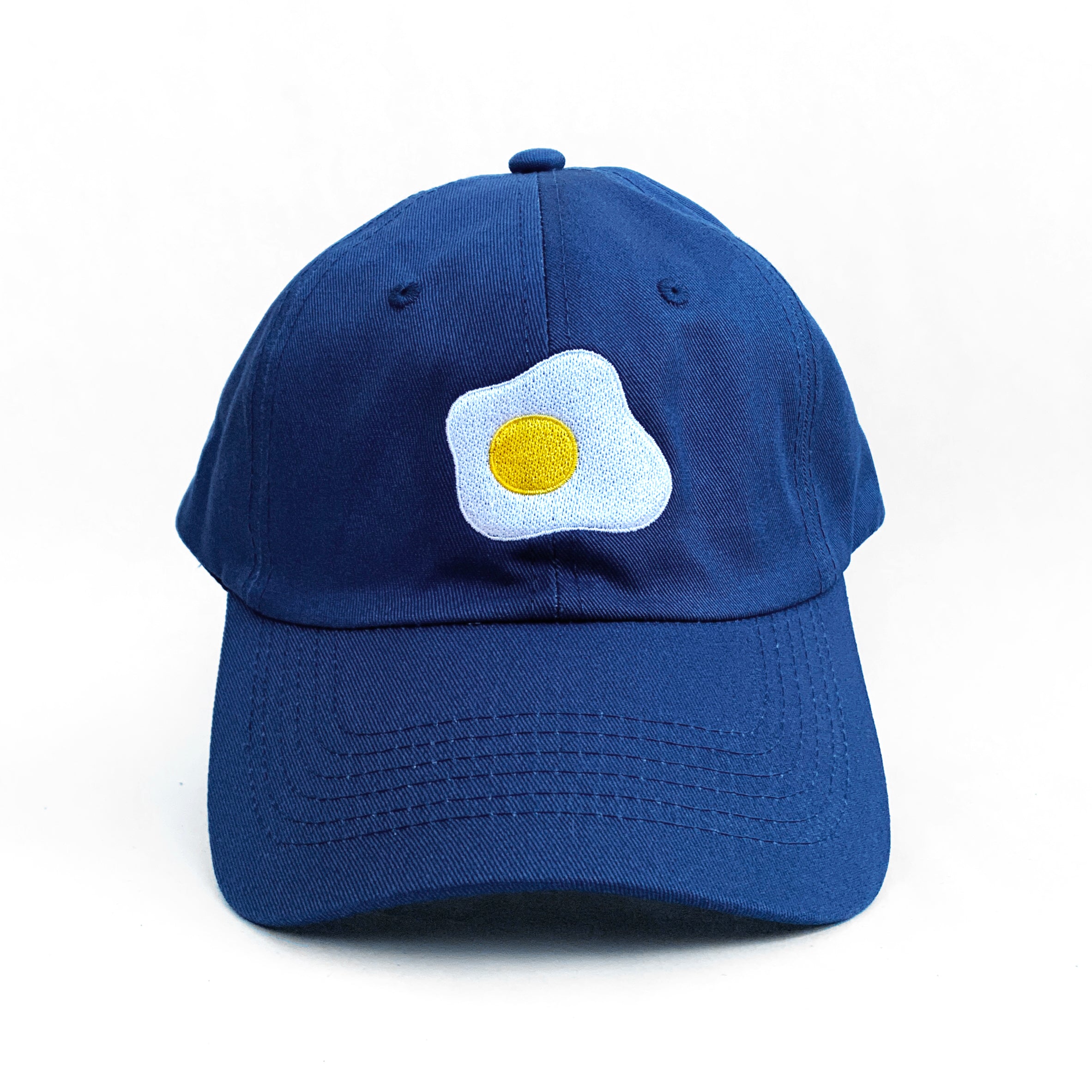 Navy blue baseball cap with fried sunny side up egg embroidered on front