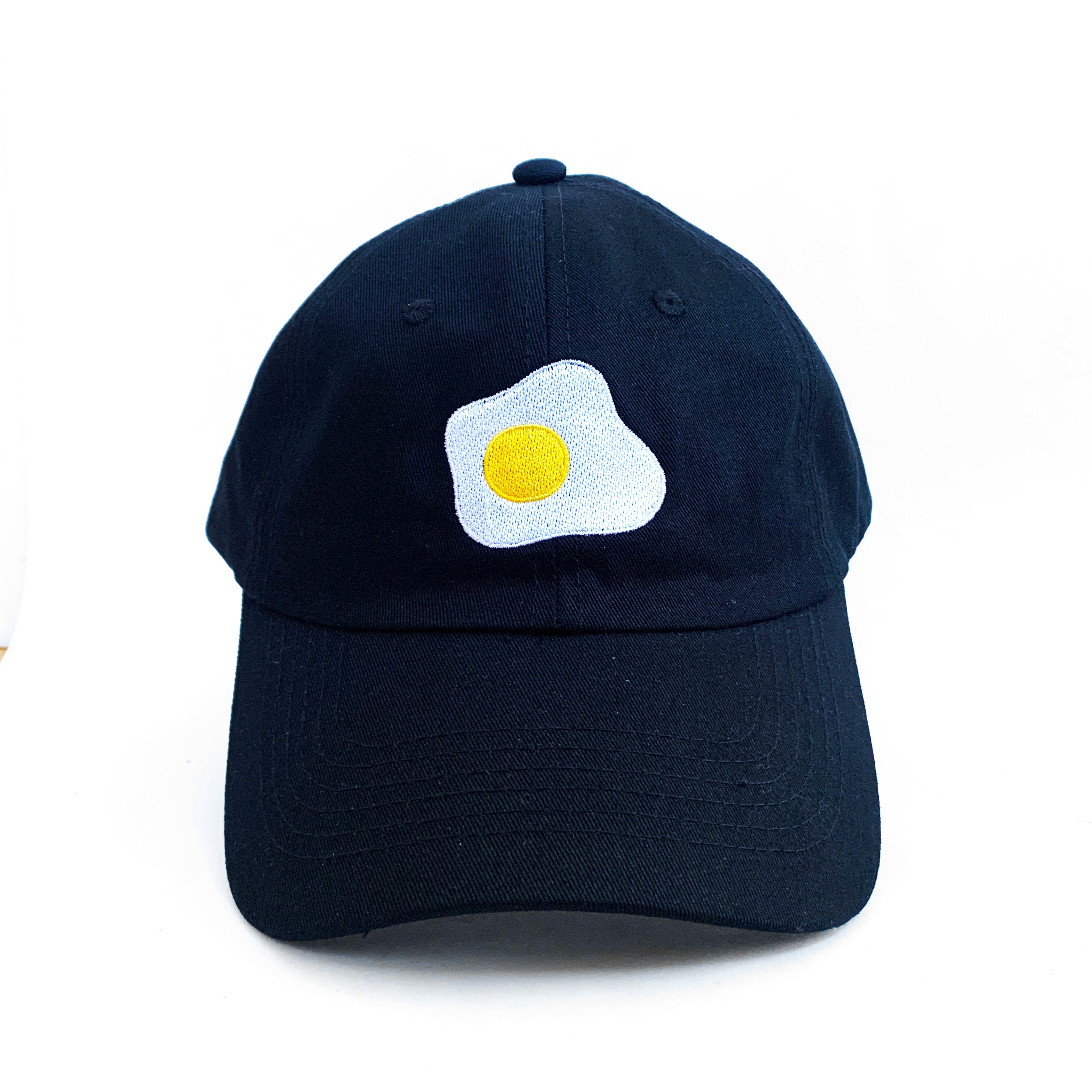 Black baseball cap with fried sunny side up egg embroidered on front