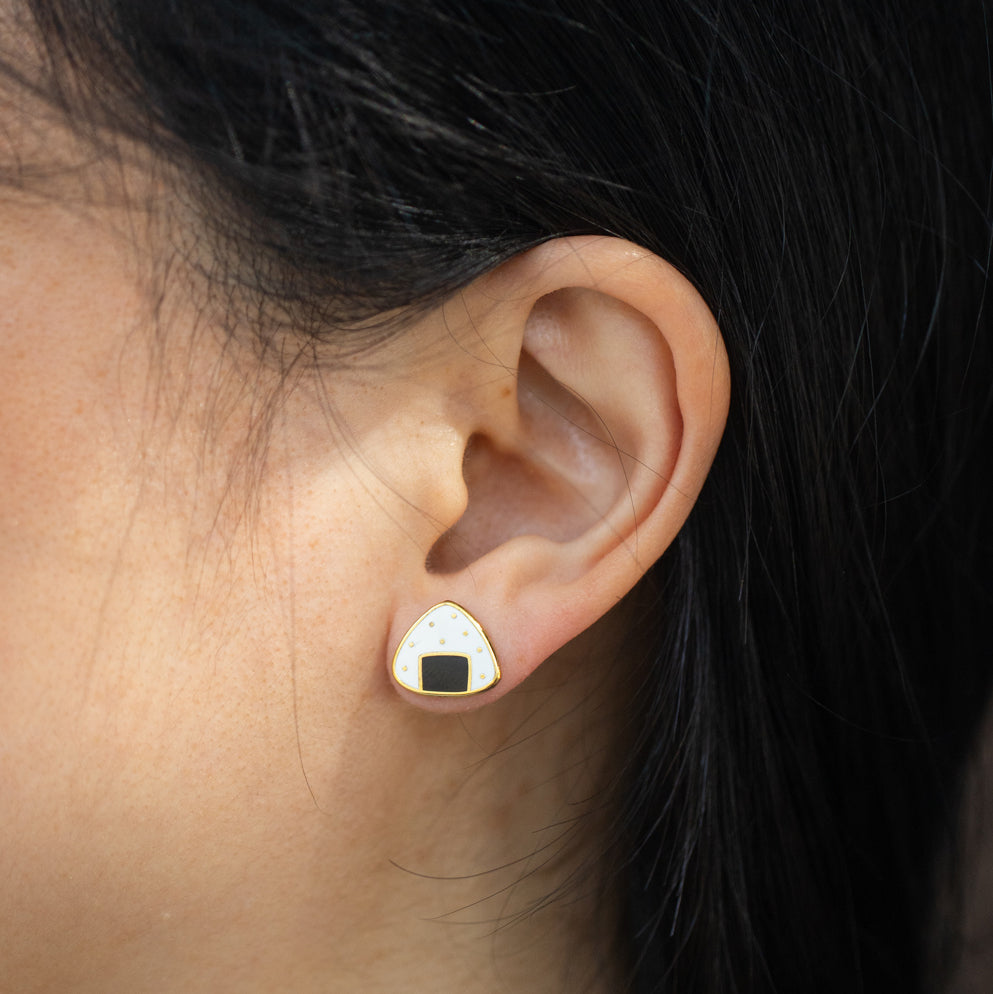 close-up of person wearing onigiri stud earring